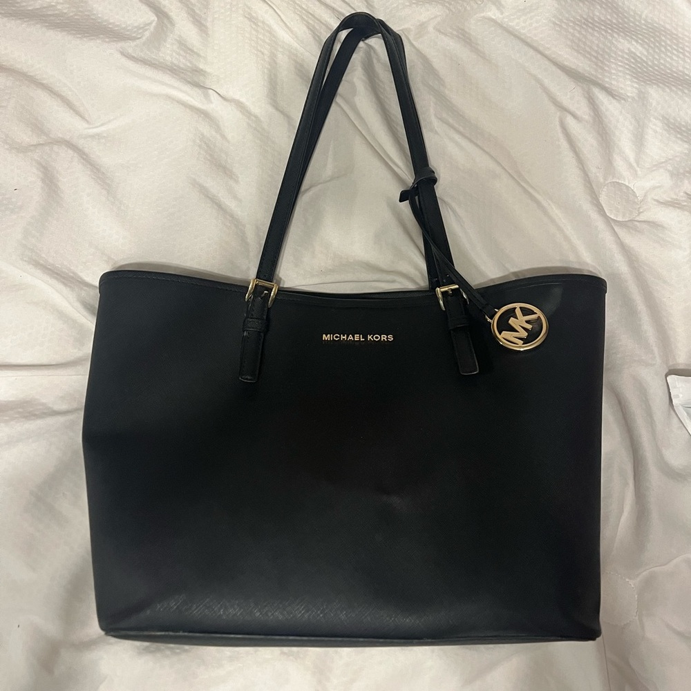 Large Michael Kors purse with cheetah print inside